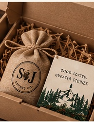 Open shipping box with coffee sack and card